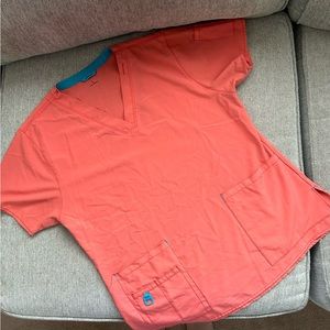 Large, CARHARTT, coral colored scrub top.